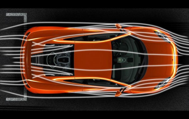 The McLaren MP4-12C undergoes wind-tunnel testing with airflow visualization.